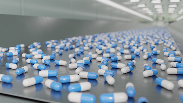 Production line blue white capsules
